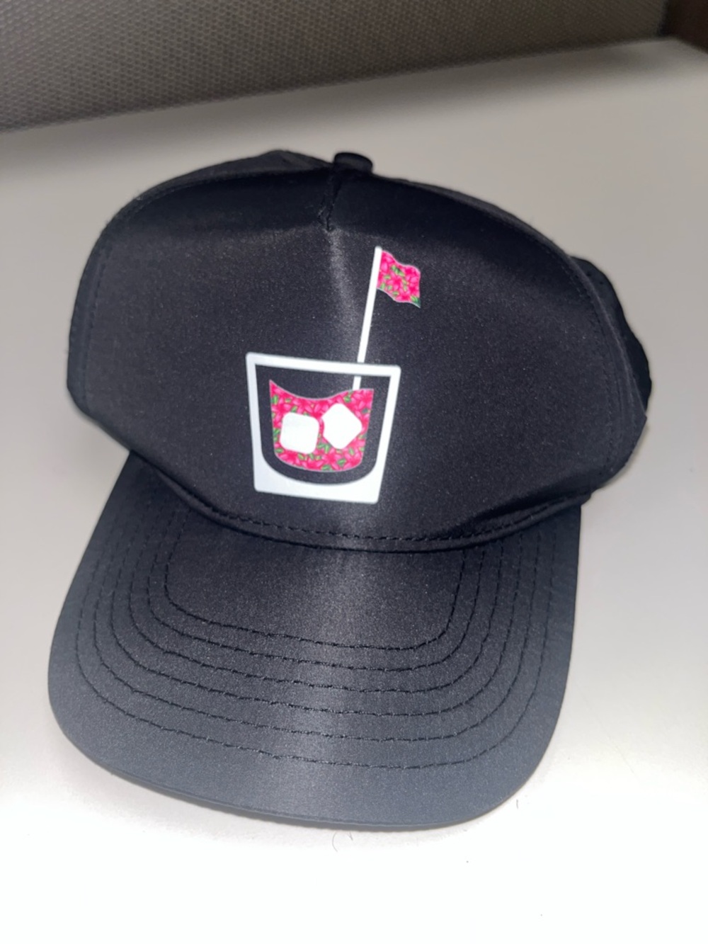 Black Trucker Hat with Pink Drink Graphic